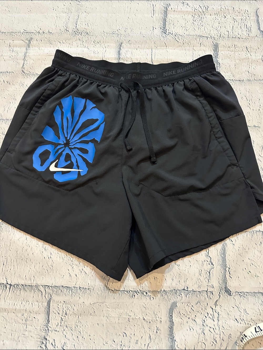 Nike Black Running Shorts with Bright Blue Floral Swoosh